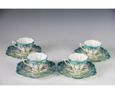 A set of four Foley China Wileman Shelley trios, each of lobed form and decorated with Art Nouveau sinuous flowers in turquoi