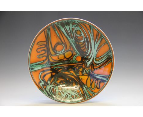 A Poole Pottery Delphis dish, decorated in orange with black and turquoise detail, No 58, 34cm diameter