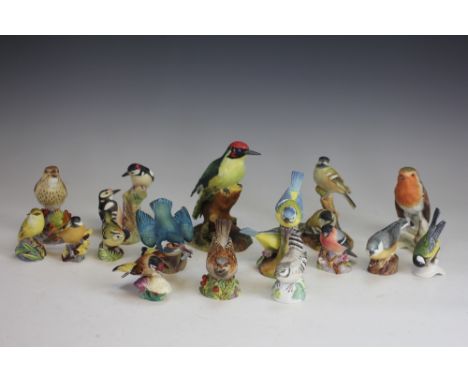 A Collection of porcelain birds, to include; Royal Worcester Cole Tits 3376, Blue Tits 3375, Pied Woodpeckers 3363, Thrush 32