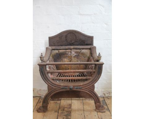 A Regency style cast iron fire grate, with X shaped frame and brass finials, 72cm H x 56cm W 