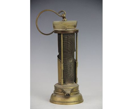 A 19th century 'Newcastle' brass miners davy lamp, with gauze centre, the domed top with makers stamp W Mellard Newcastle, 22