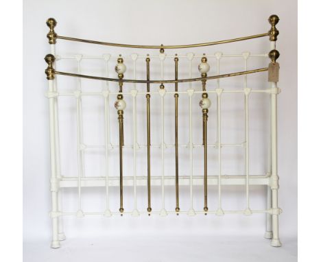 A late 19th / early 20th century painted cast iron and brass double bed, with ceramic foliate ball frame, 139cm H x 200cm W x
