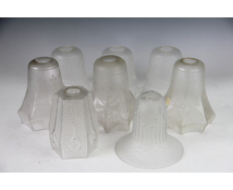 A pair of Art Nouveau Secessionist clear glass light shades, 14.5cm, a set of three moulded and opaque glass shades and three
