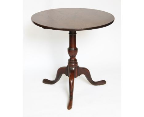 A George III mahogany tilt top occasional table, with turned column and tripod base, 71cm H x 70cm diameter