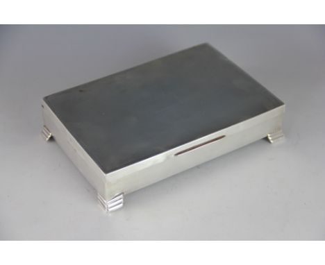 A rectangular silver cigarette box, Viner's Ltd, Sheffield 1959, the engine turned hinged cover with vacant cartouche raised 