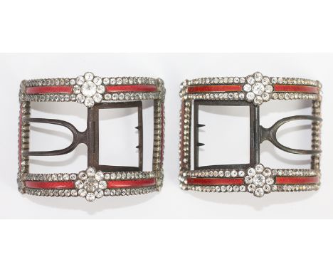 A pair of Georgian shoe buckles, the domed, rectangular buckle, set with a paste border and floral detail with red enamel ban