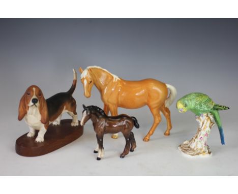 A Beswick model of a chestnut horse, 18cm, with a boxer, a Ch Ulrica of Brittas, a Ch cast iron Monarch, another dog, a foal,