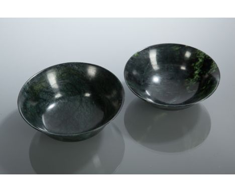 PAIR OF CHINESE SPINACH JADE BOWLS
of circular form, 12.5cm diameter 
