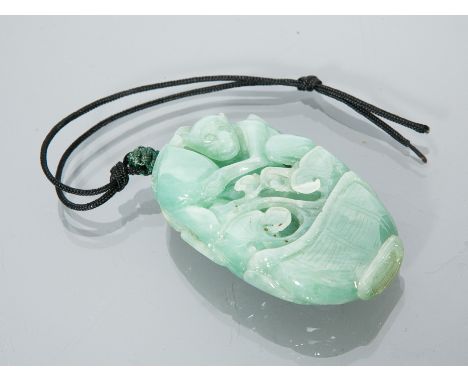 CHINESE JADE CARVING 
showing a monkey with peach, 6.5cm high