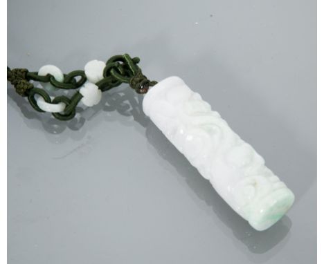 CHINESE JADE AMULET
of cylindrical form, with purple tints, on fabric chain, the jade 6cm long 