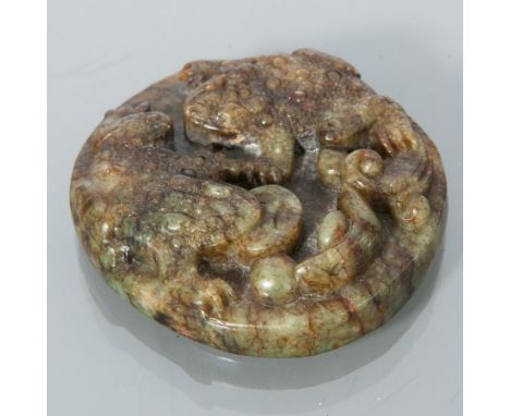CHINESE RUSSET-CELADON JADE PENDANT
deeply carved with two three-legged toads, 5cm diameter 