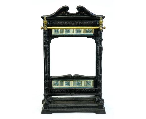 A Victorian tiled cast iron stick stand,&nbsp; with brass rails, 75cm h, lozenge shaped PODR mark and number  