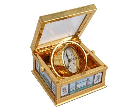 Halcyon Days. An enamel inset gilt brass gimballed desk timepiece, late 20th c, with bevelled glass inset hinged top, the sid