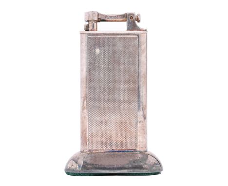 An Alfred Dunhill silver plated table lighter, engine turned, 10cm h  Good condition. Little sign of use