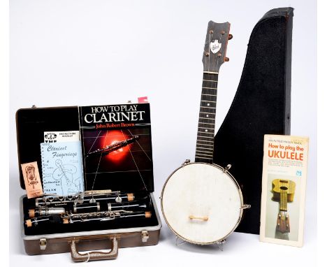 A Keech ukelele,&nbsp; cased and a Buescher clarinet, cased  Good condition