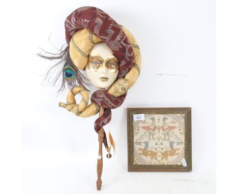 An Atelier Lago ceramic Venetian mask, and a Byzantine tapestry panel from Florence, framed (2) 