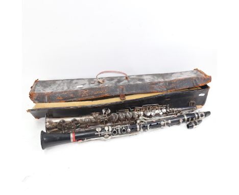 A Besson silver plated clarinet, and an ebony clarinet with plated mounts 