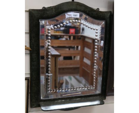 An Antique bevel-edge mirror, with decorative cut borders and velvet-covered frame, with shelf, height 54cm 
