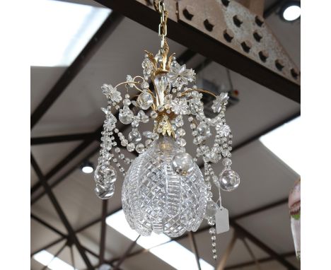 A gilt-metal chandelier, with swags of lustre drops and cut-glass light bowl, 26cm across 