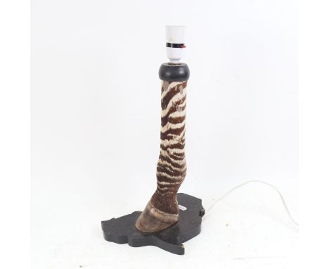 TAXIDERMY - a zebra's leg and hoof table lamp, height 43cm 