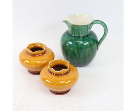 CHRISTOPHER DRESSER for LINTHORPE POTTERY - a green glaze Studio pottery jug, model 816, and a pair of Linthorpe yellow glaze