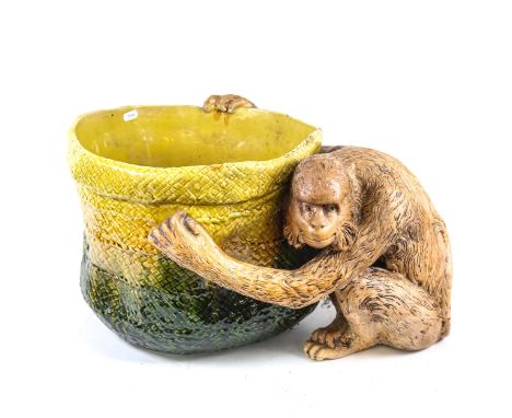 A large Bretby figural pottery jardiniere, modelled as a monkey holding a basket, model no. 1251, basket diameter 35cm, heigh