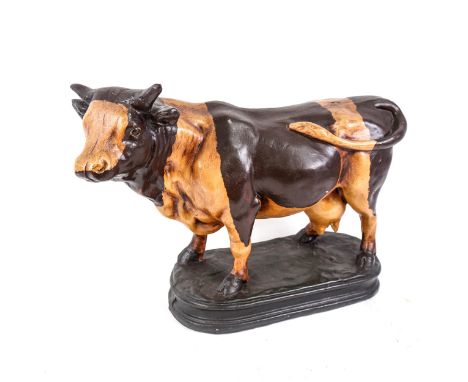 A reproduction painted composition butcher's bull advertising figure, length 50cm, height 35cmNo damage or repair, only a few