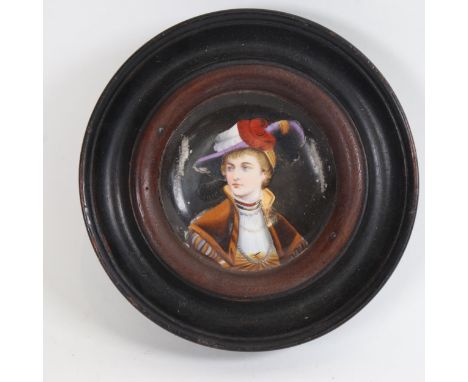 A miniature hand painted porcelain panel, depicting head and shoulders portrait of lady, framed, overall diameter 16.5cm 