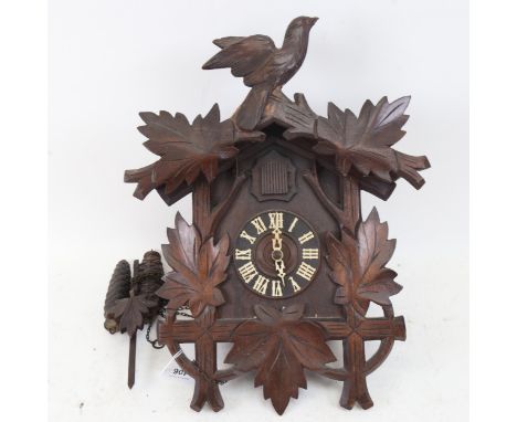 A Black Forest carved wood cuckoo clock, height 39cm 