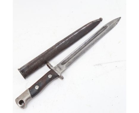 A First World War Period bayonet and scabbard, blade length 25cm 