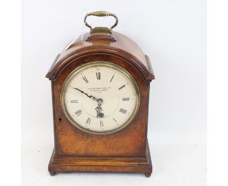 An Antique walnut-cased mantel clock by Hicklenton & Phillips, now with quartz movement, height 59cm overall 
