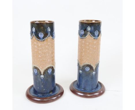 A pair of Art Nouveau Royal Doulton stoneware cylinder vases, model no. 8409, height 20cm 