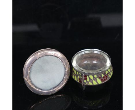 A small oval silver-fronted photo frame, and a green and red enamel salt with glass liner 