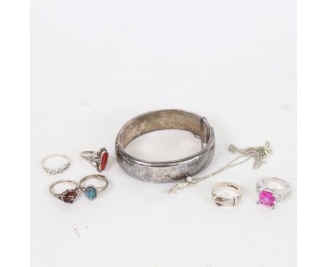 A group of silver jewellery, to include an engraved hinged bangle, 4 stone set rings, buckle ring etc 