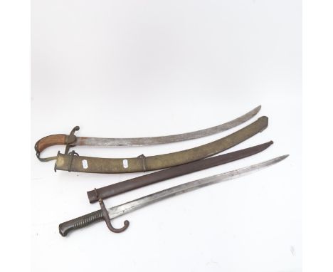 A French 1871 pattern sword bayonet and scabbard, and a Middle Eastern tulwar sword and scabbard (2) 