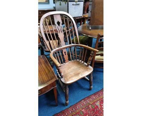 A stick back Windsor armchair.