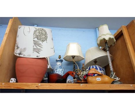 Shelf of lamps.