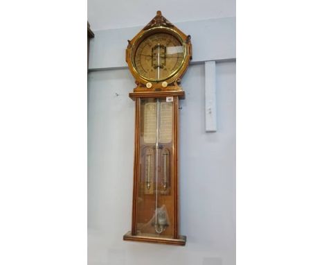 A Victorian carved oak Royal Polytechnic barometer by Joseph Davis and Company, London.  105cm long