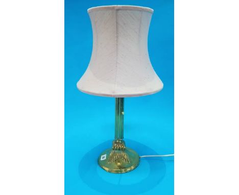A brass table lamp.