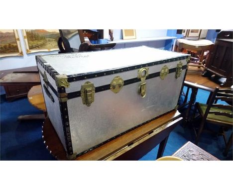 A large silver coloured trunk.