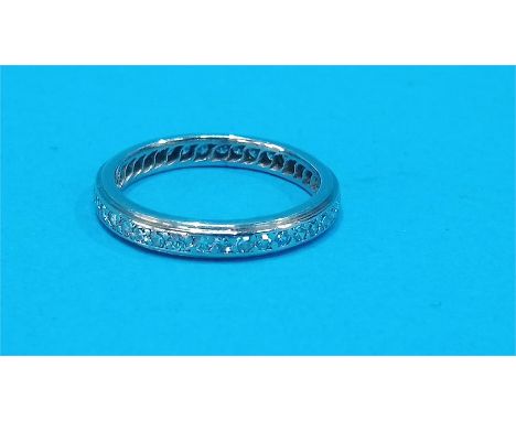 A platinum diamond full eternity ring.