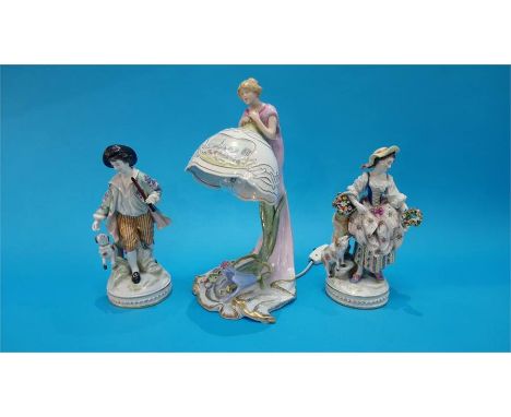 A pair of Continental porcelain figures of a gallant and a lady, blue marks in underglaze blue and a Continental porcelain ta
