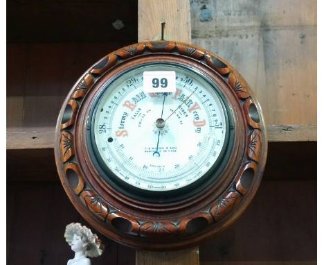 A T.B. Winter and Sons of Newcastle upon Tyne walnut circular barometer.  21cm diameter