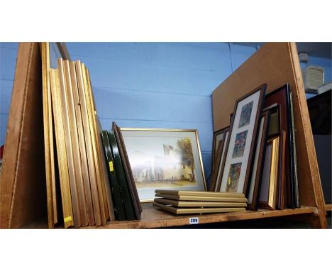 Shelf of prints and pictures.