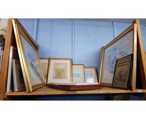 Shelf of pictures.