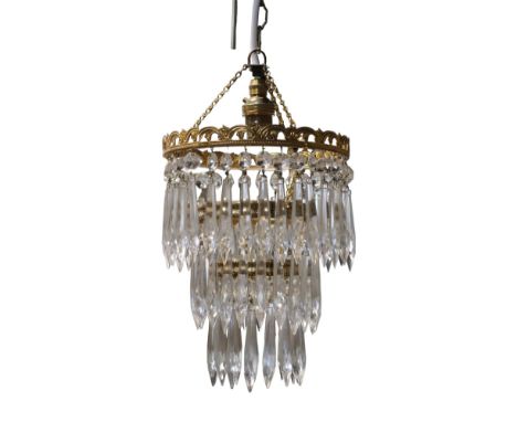 A gilt metal three tiered glass chandelier, second quarter 20th Century, 43 cm 