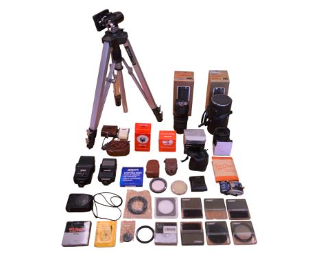 A quantity of camera equipment including two Vivitar lenses; f1:38 and f1:3.5, a Helios teleconverter, Titanium NiteVision in