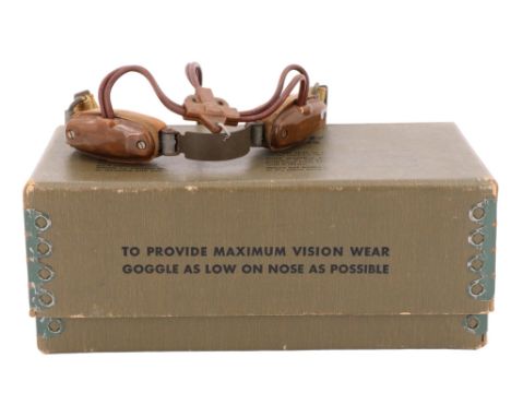 A US M-1944 Goggles carton and spare lenses, together with a British army signaler's laryngophone