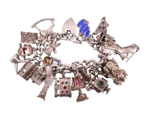 A vintage silver charm bracelet, 140 g