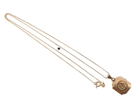A contemporary 9 ct gold locket on a princess length neck chain, having canted corners and a linear engine turned face decora